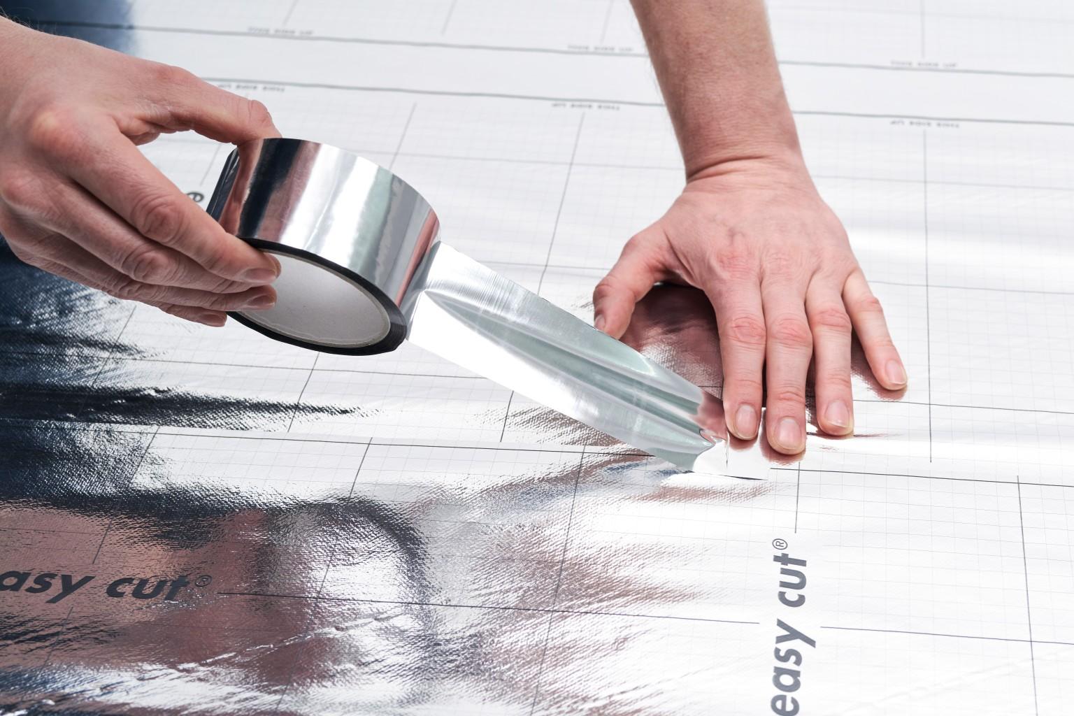 EGGER self-adhesive Aluminium Sealing Tape connects two joints of EGGER underlay materials