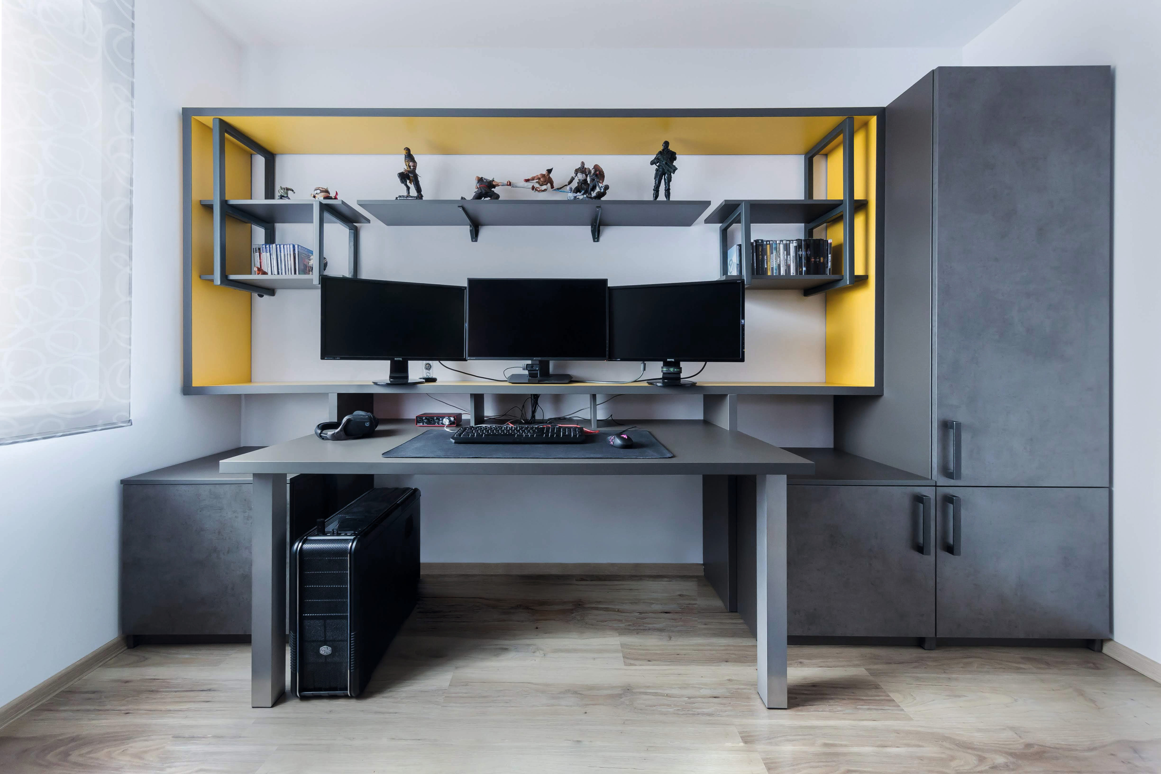 The office area is designed in greyish tones with yellow accents. 