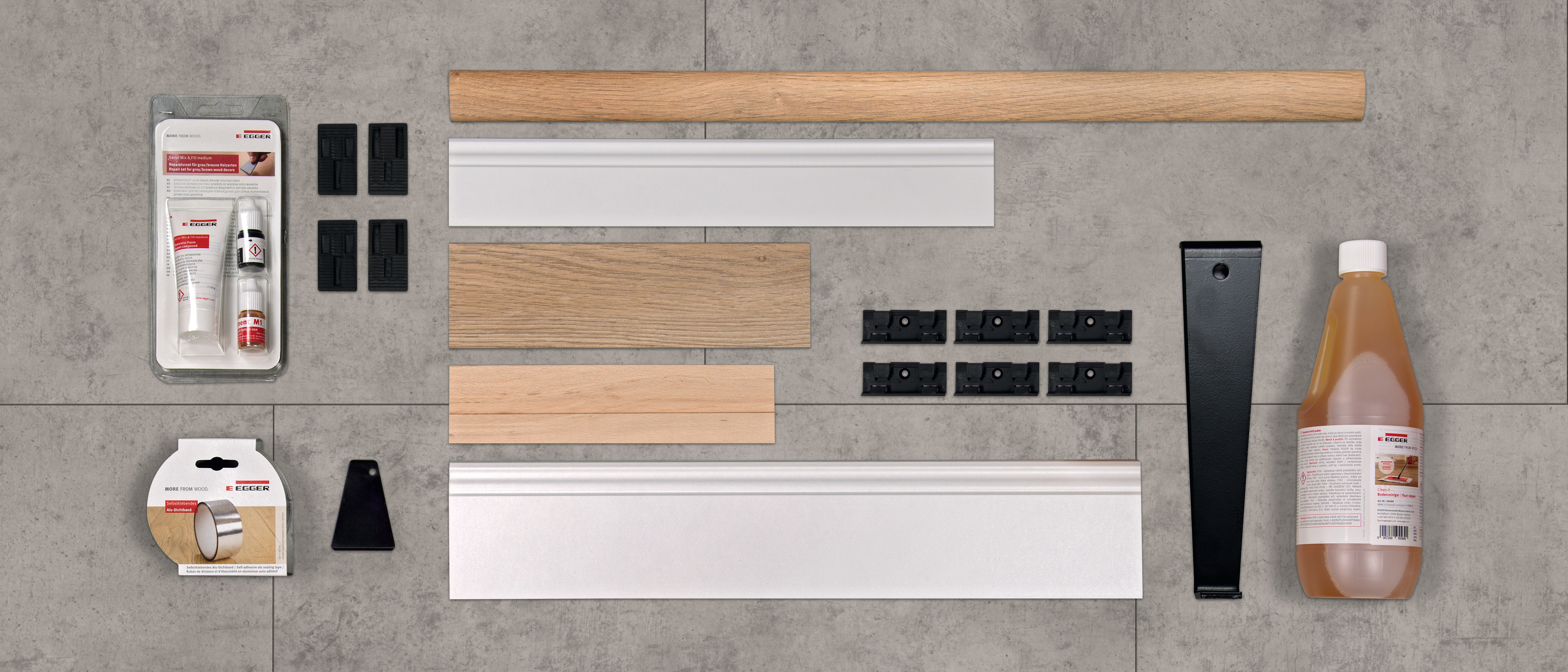 Accesorios para pisos incluyendo zócalos, cuñas distanciadoras, accesorios de instalación y productos de cuidado.