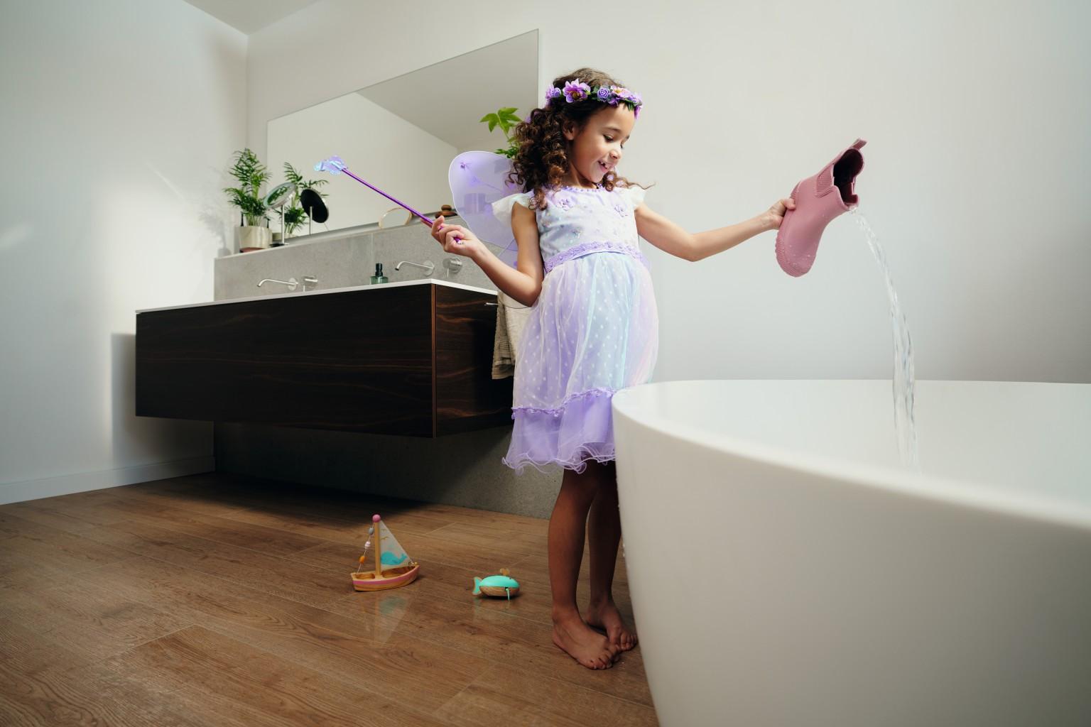 Bathroom playtime: NatureSense Aqua+ Turin Oak - the perfect waterproof flooring in an oak finish for vibrant spaces.
