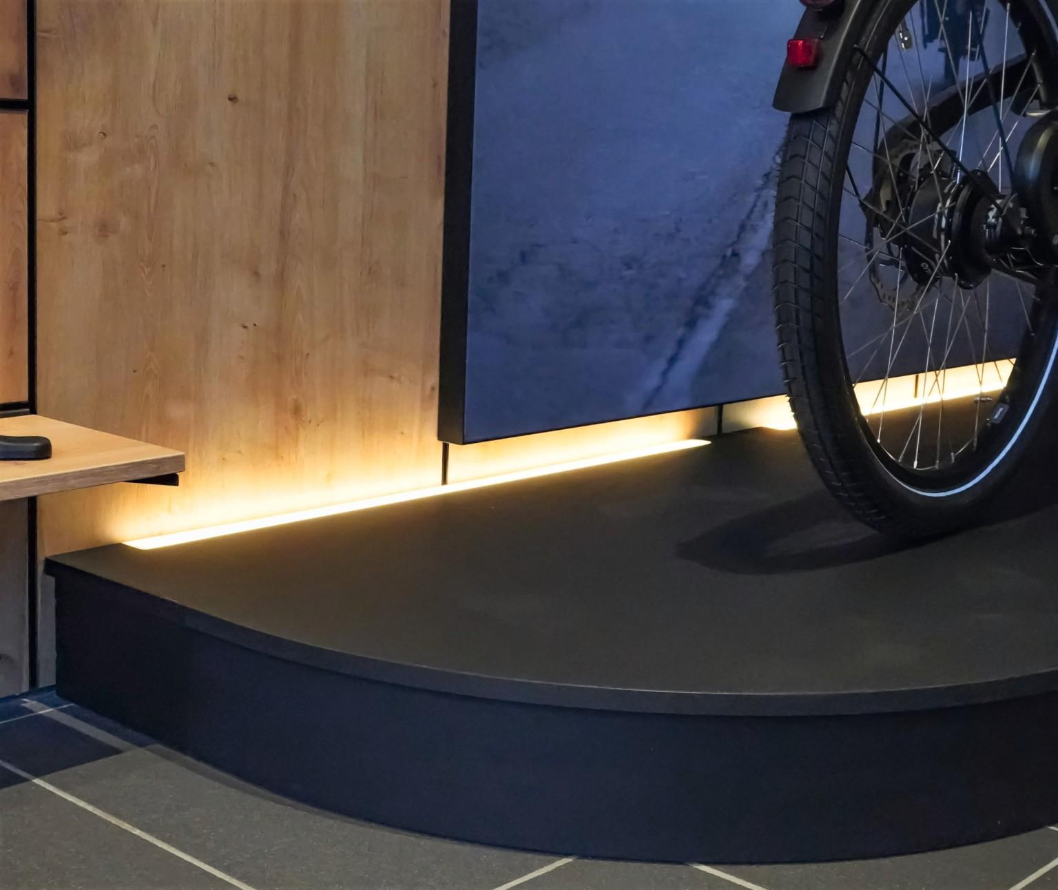 The pedestals for the bicycles were made out of U999 PM Black and H3303 ST10 Hamilton Oak. 