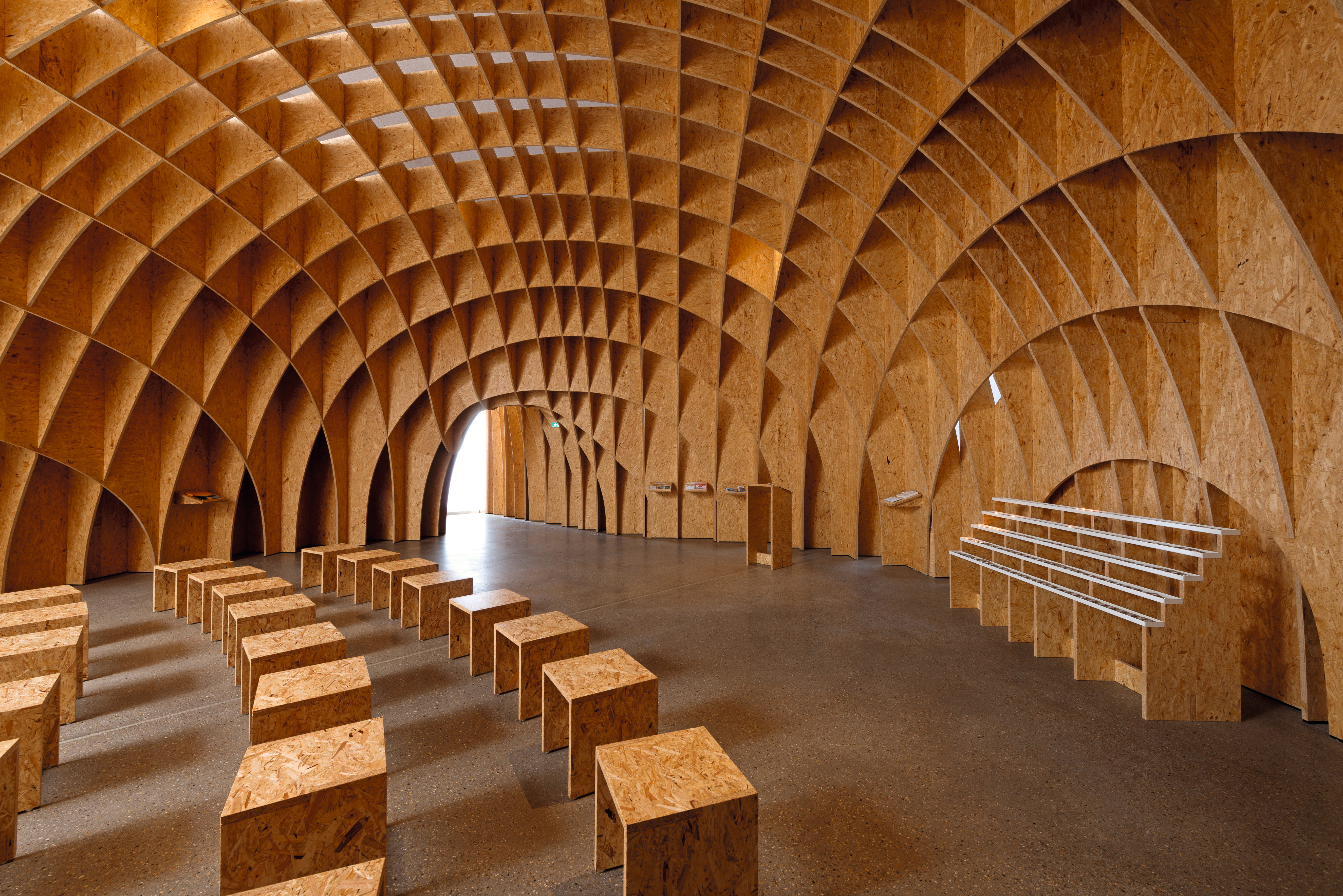 The delicate ribbed structure of the filigree wooden arch.