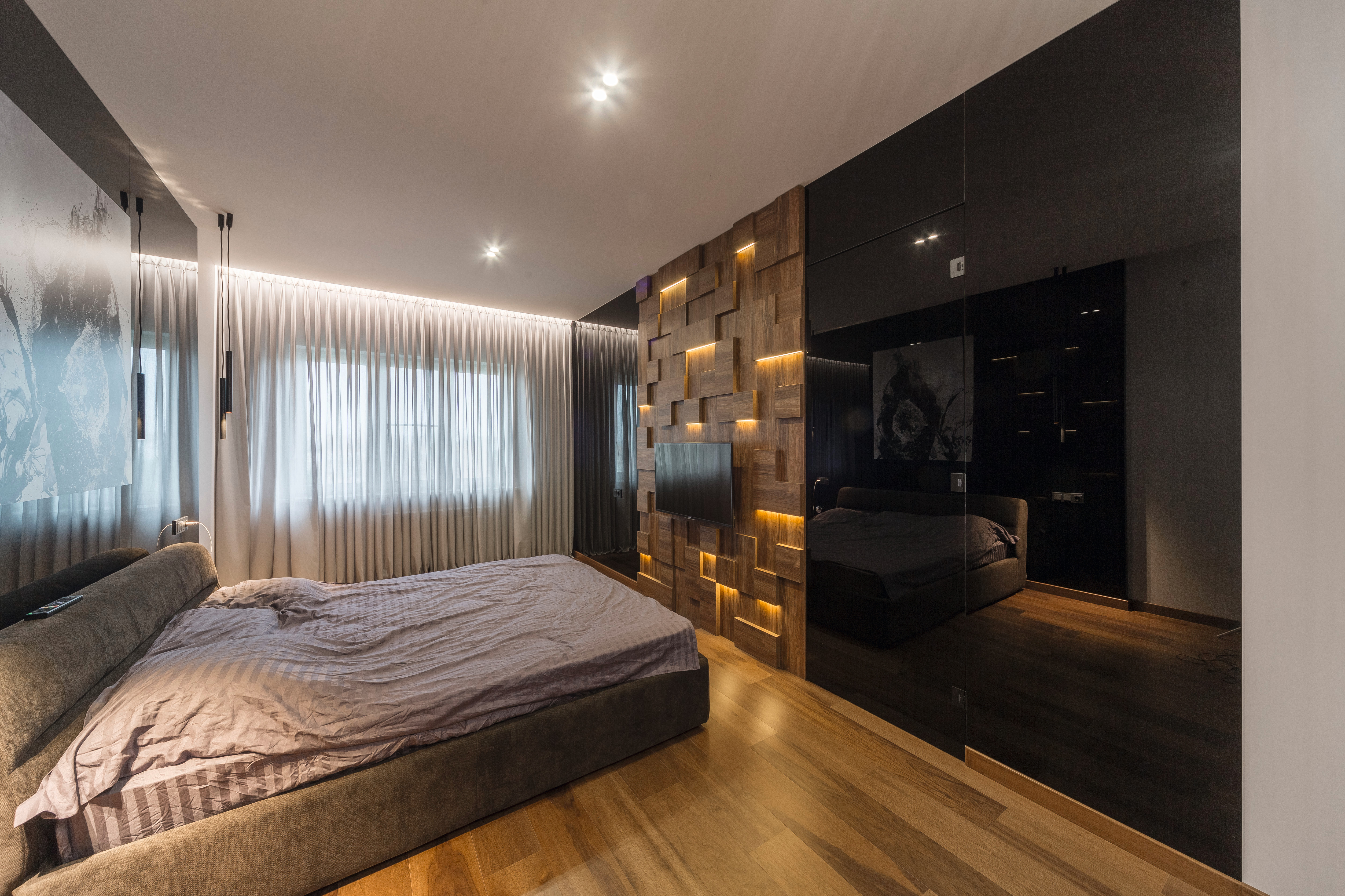 Decorated wall panel in H3154 ST36 Dark Brown Charleston Oak with fitted lighting