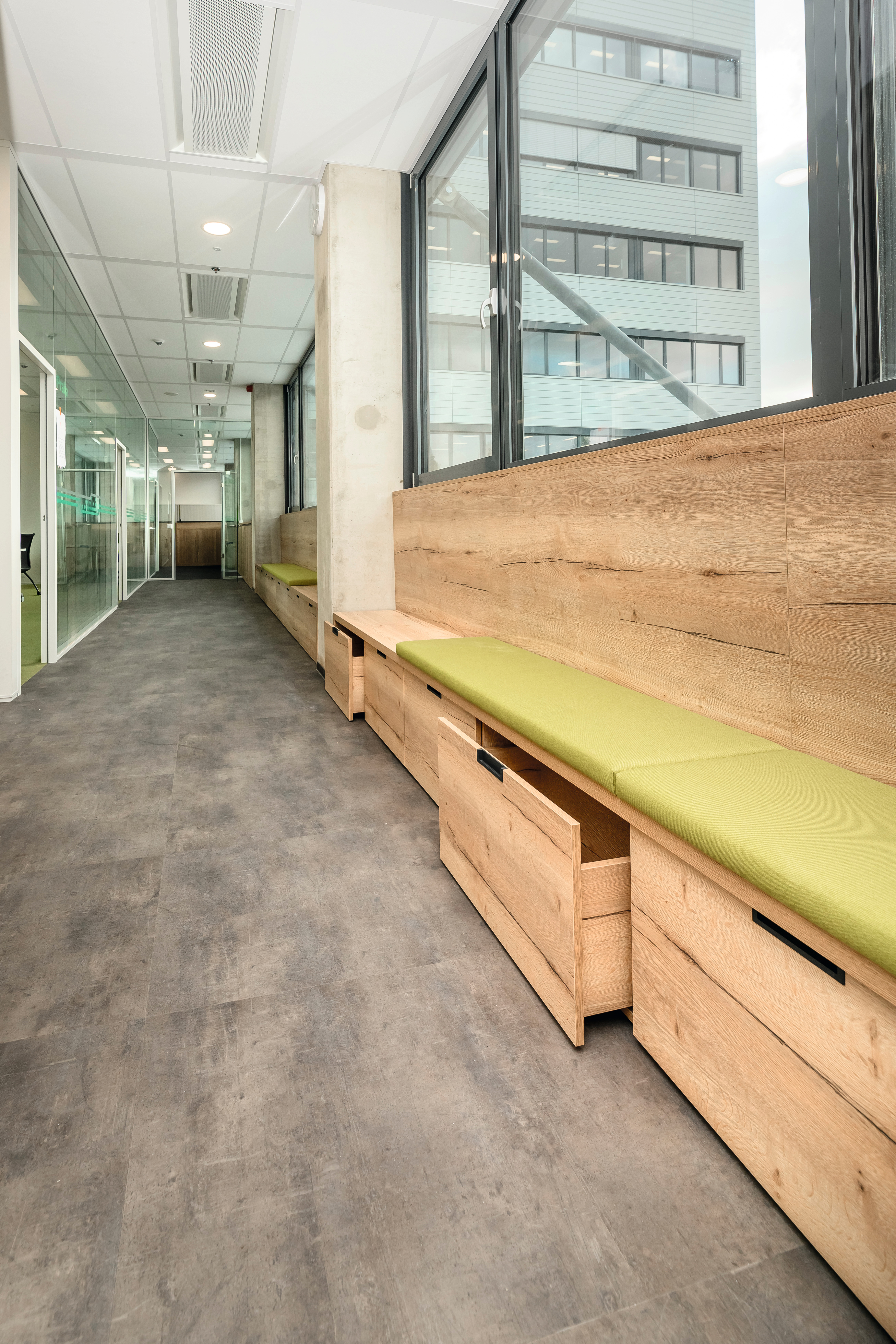 Natural Halifax Oak was used for the furniture, which functions as both seating and storage. 