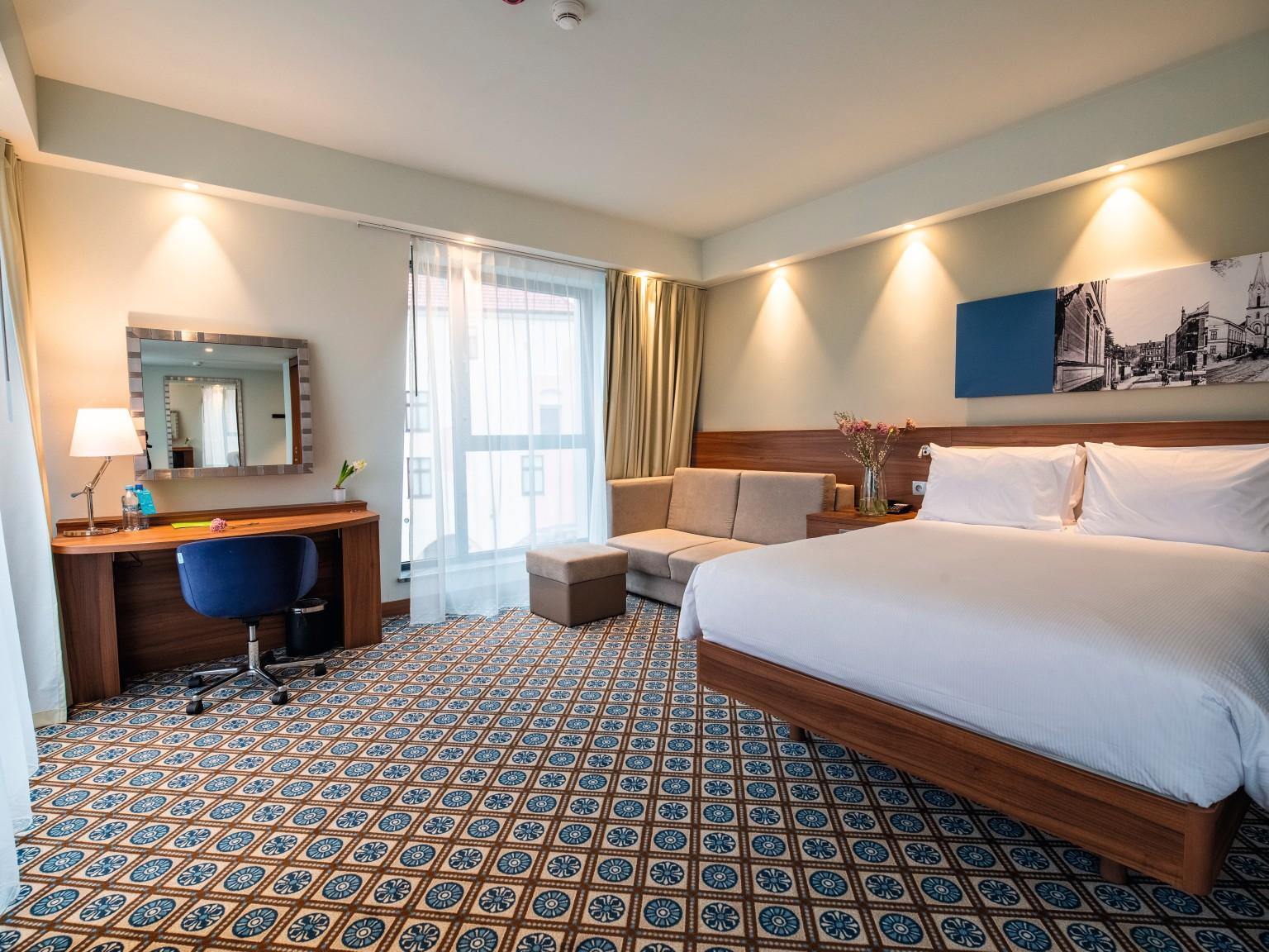 H3734 ST9 Natural Dijon Walnut is used in the hotel rooms to create a modern look.