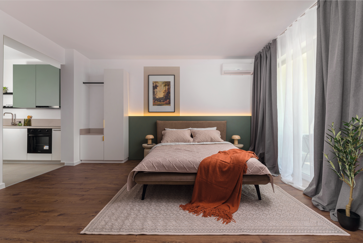Minimalist bedroom with soft colors and green accent headboard