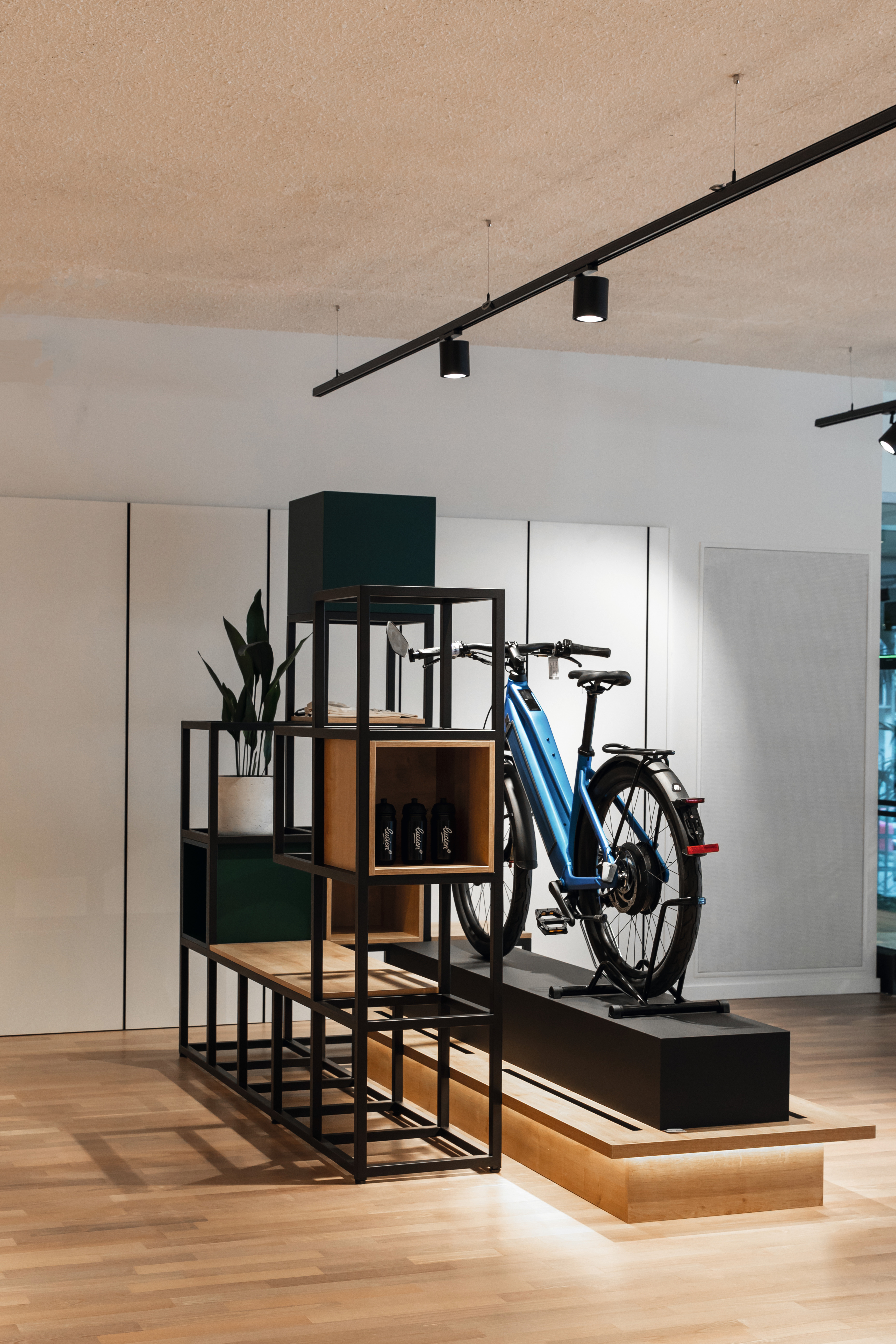 Bicycles are displayed on pedestals made of U999 PT Black.
