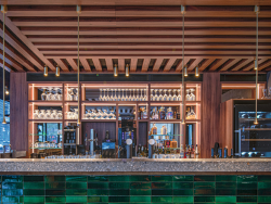 The H3734 ST9 Dijon Walnut applied in a bar pattern makes the ceiling an eye-catcher.