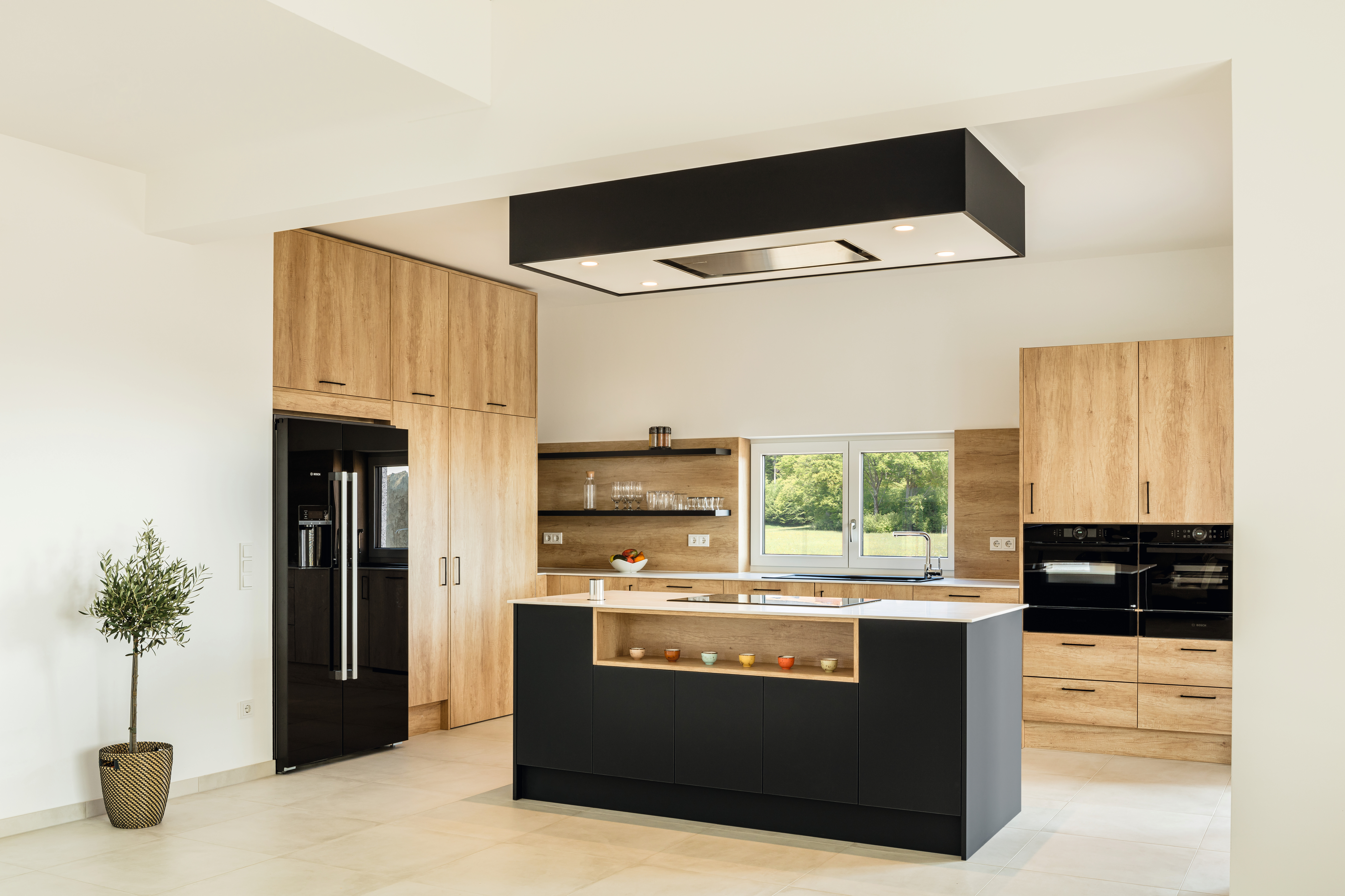 Elegant and natural kitchen design by Fuzzy's Woodart.