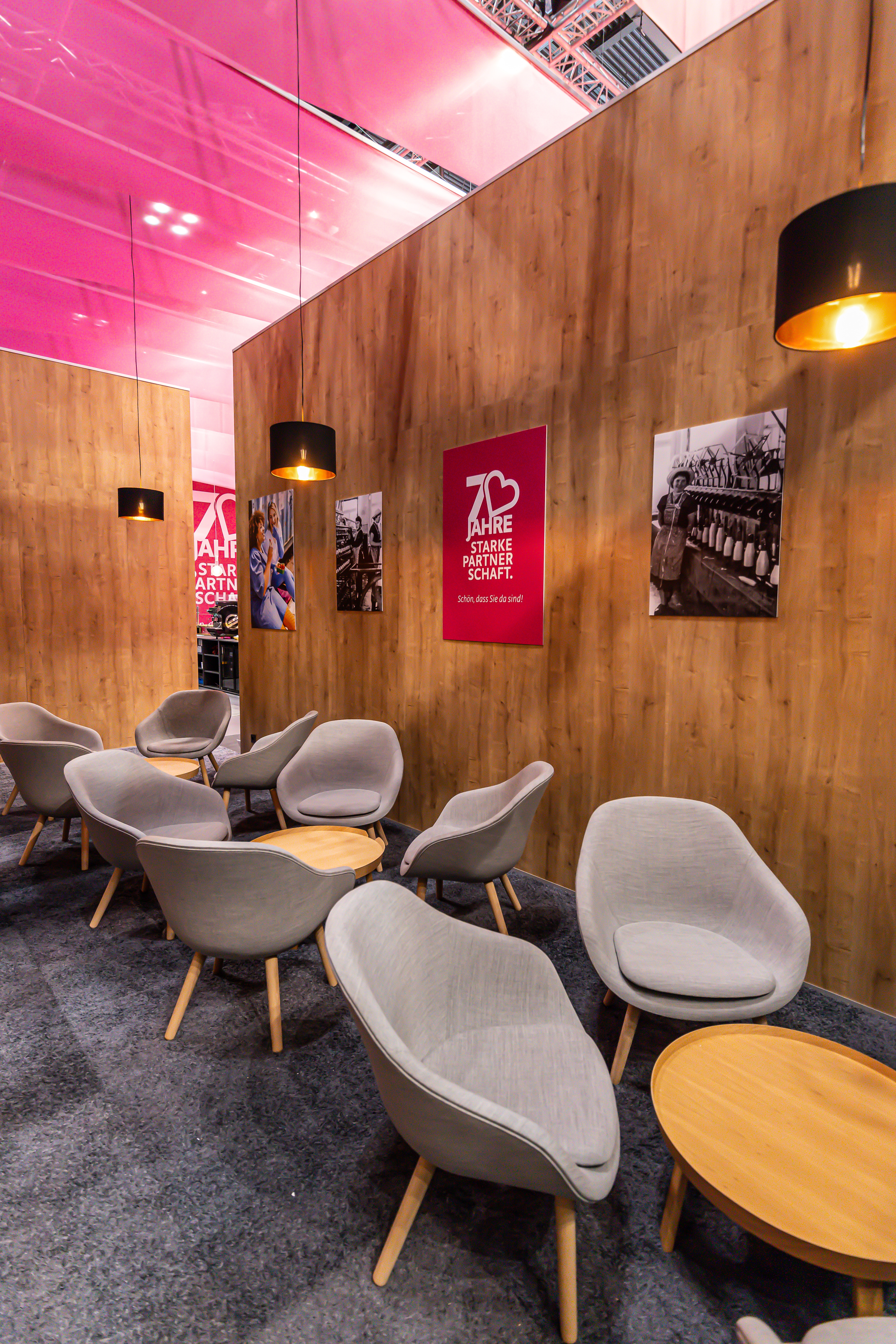 The seating area is screened off by partition walls made of H3303 ST10 Hamilton Oak. 
