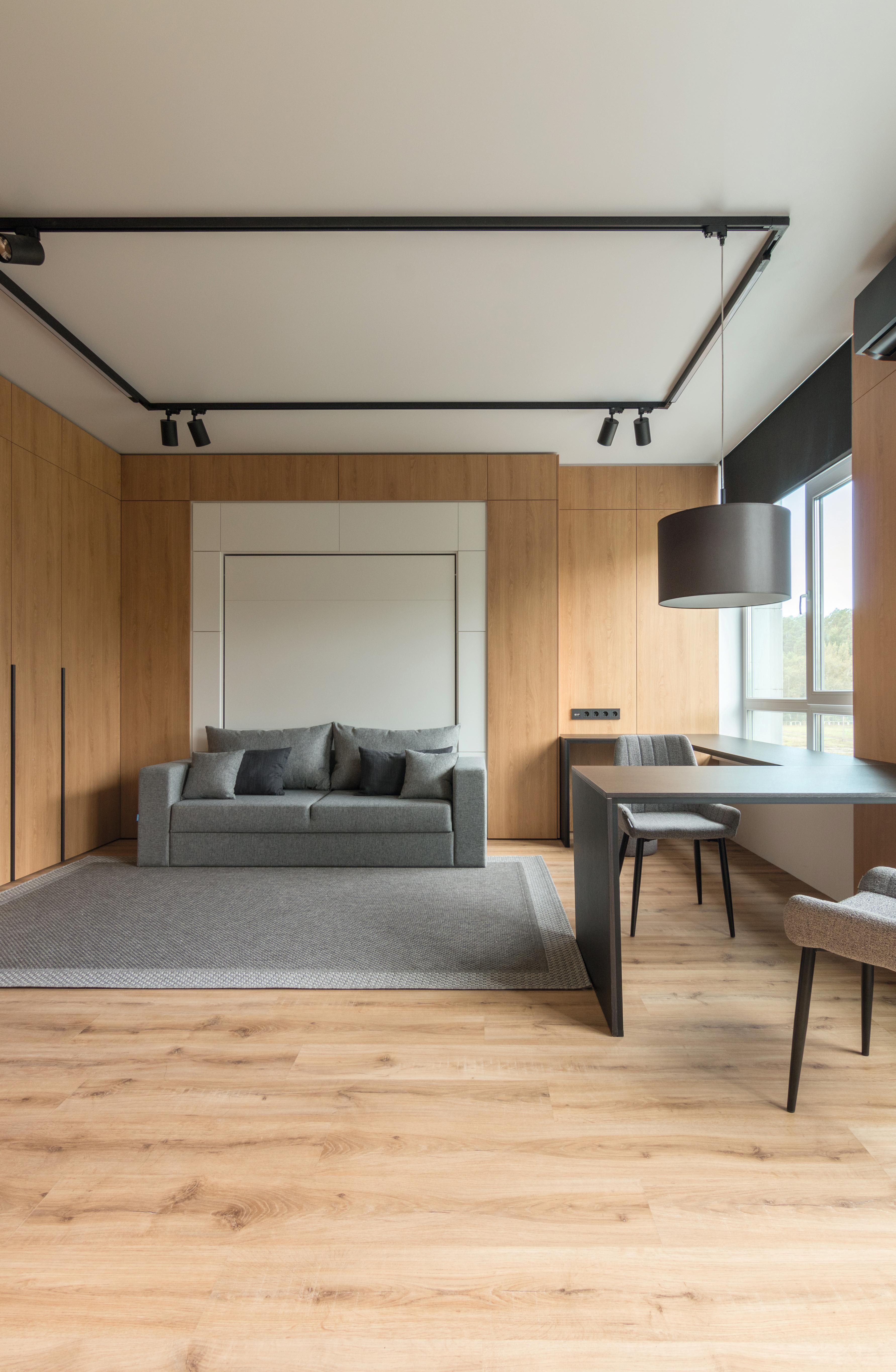 The wall cladding in Natural Corbridge Oak creates a cosy living atmosphere.